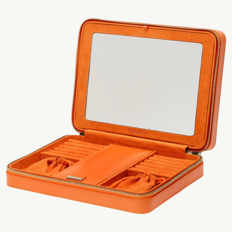 Orange jewelry case with mirror on a white background