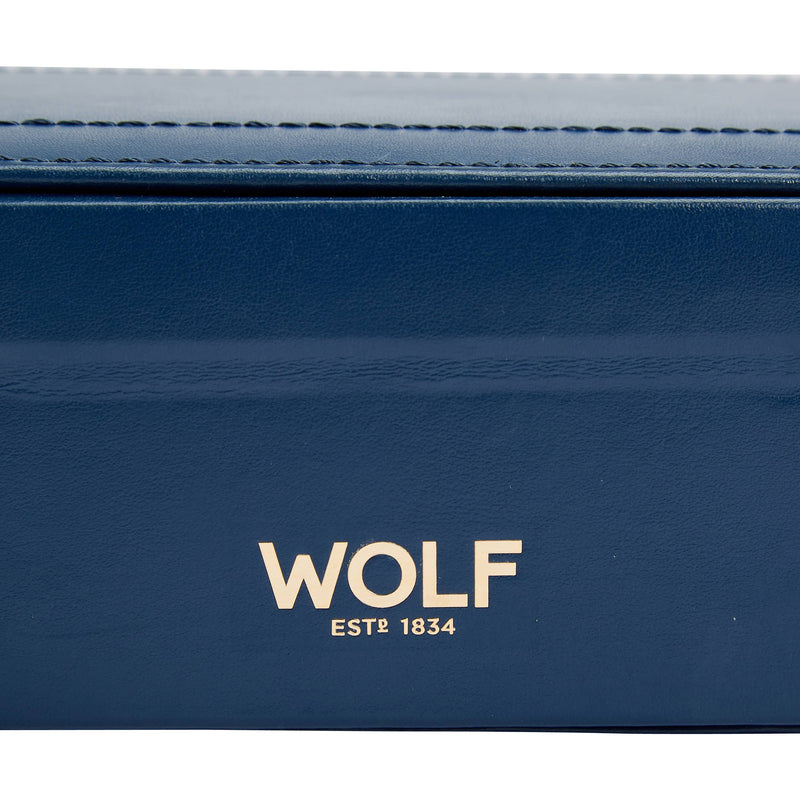 Blue leather wallet with 'WOLF EST® 1834' branding.