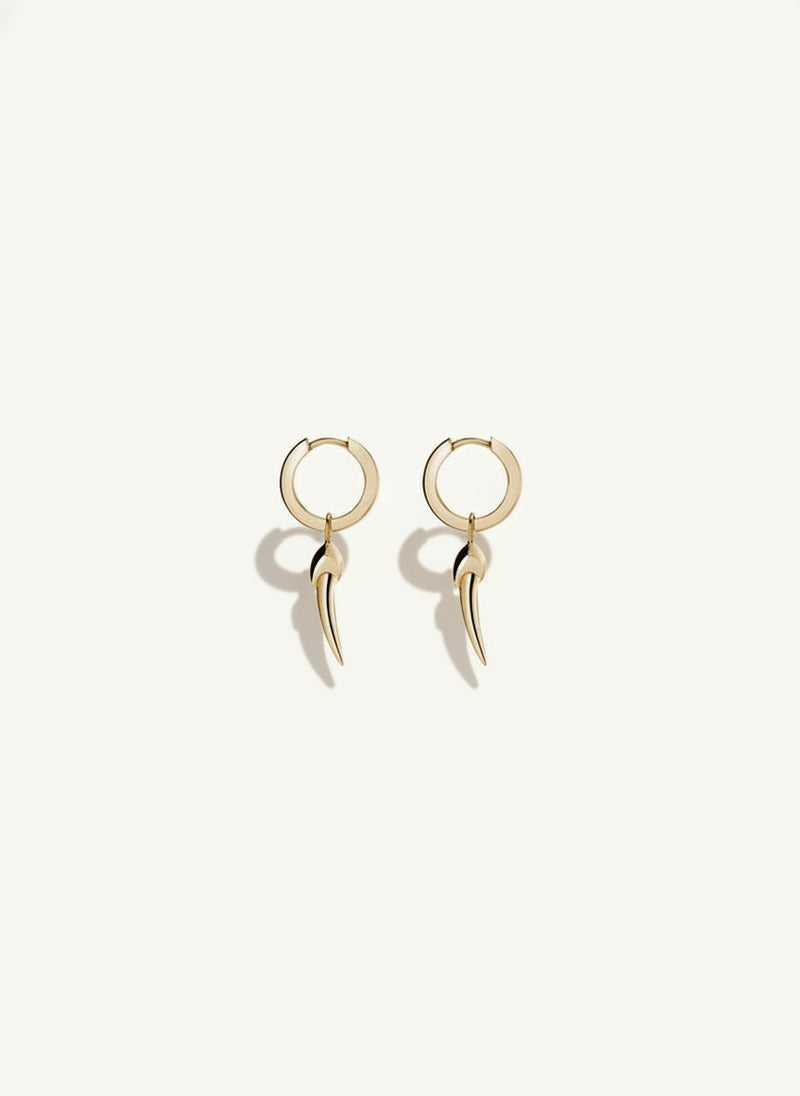 A pair of small hoop earrings with a talisman pendant, crafted in 18K yellow gold.