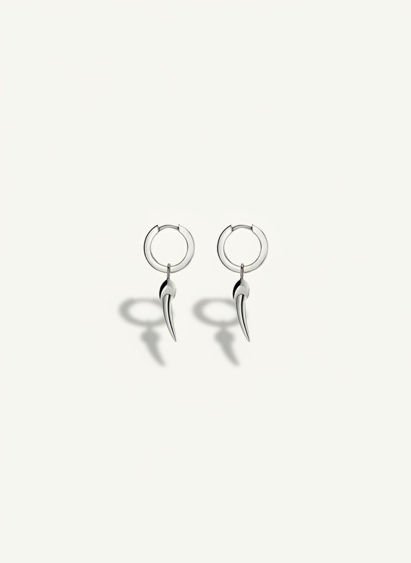 Pair of silver hoop earrings on a white background